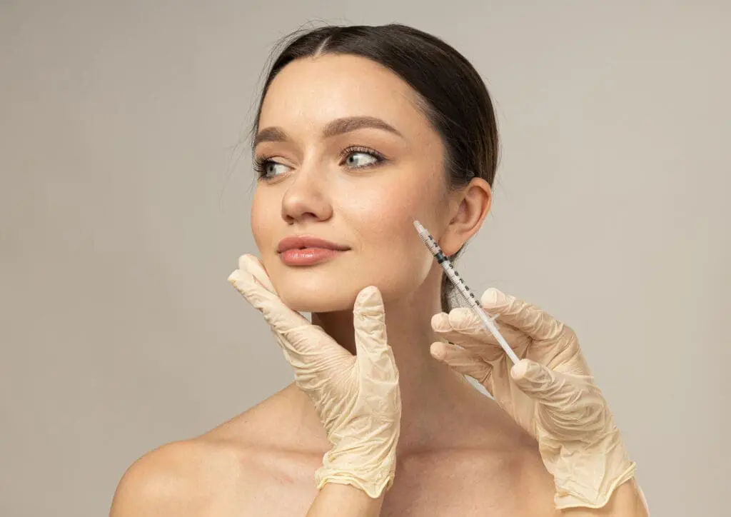At Refresh MedSpa in Cape Coral, FL, a woman receives a cosmetic injection in her cheek from a gloved professional, highlighting popular Botox alternatives.