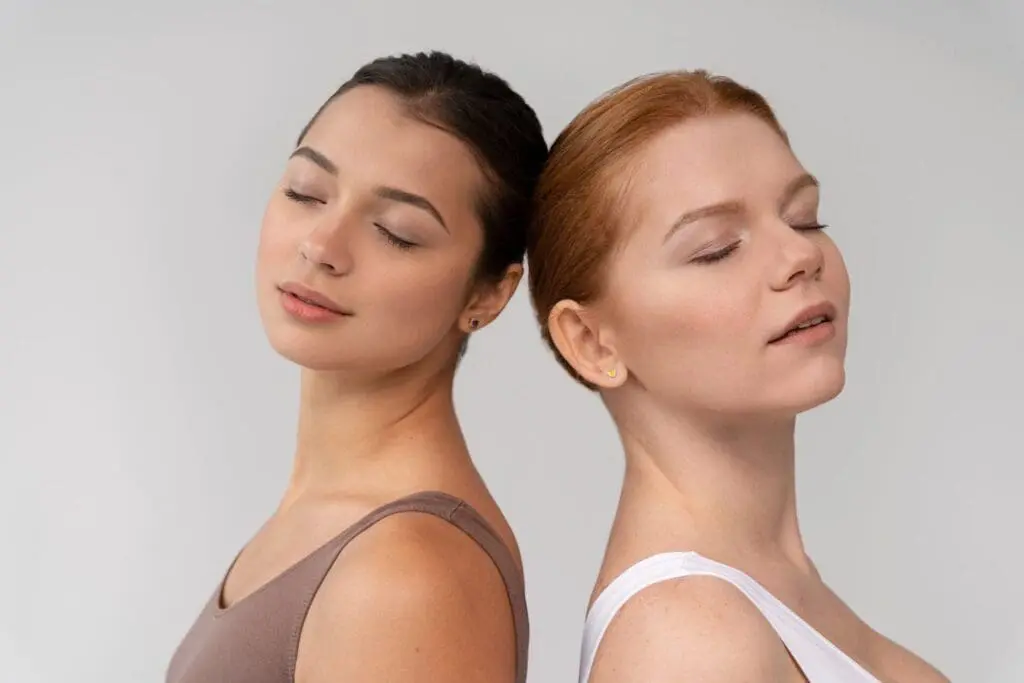 Two women with smooth, youthful skin leaning back-to-back, representing Dysport vs Botox treatments at Refresh MedSpa in Cape Coral, FL.