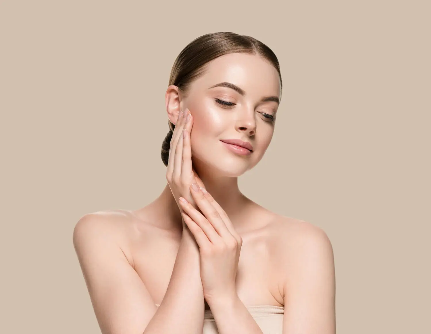 A woman with glowing skin gently touches her face, highlighting Refresh MedSpa’s skin tightening in Cape Coral, FL.